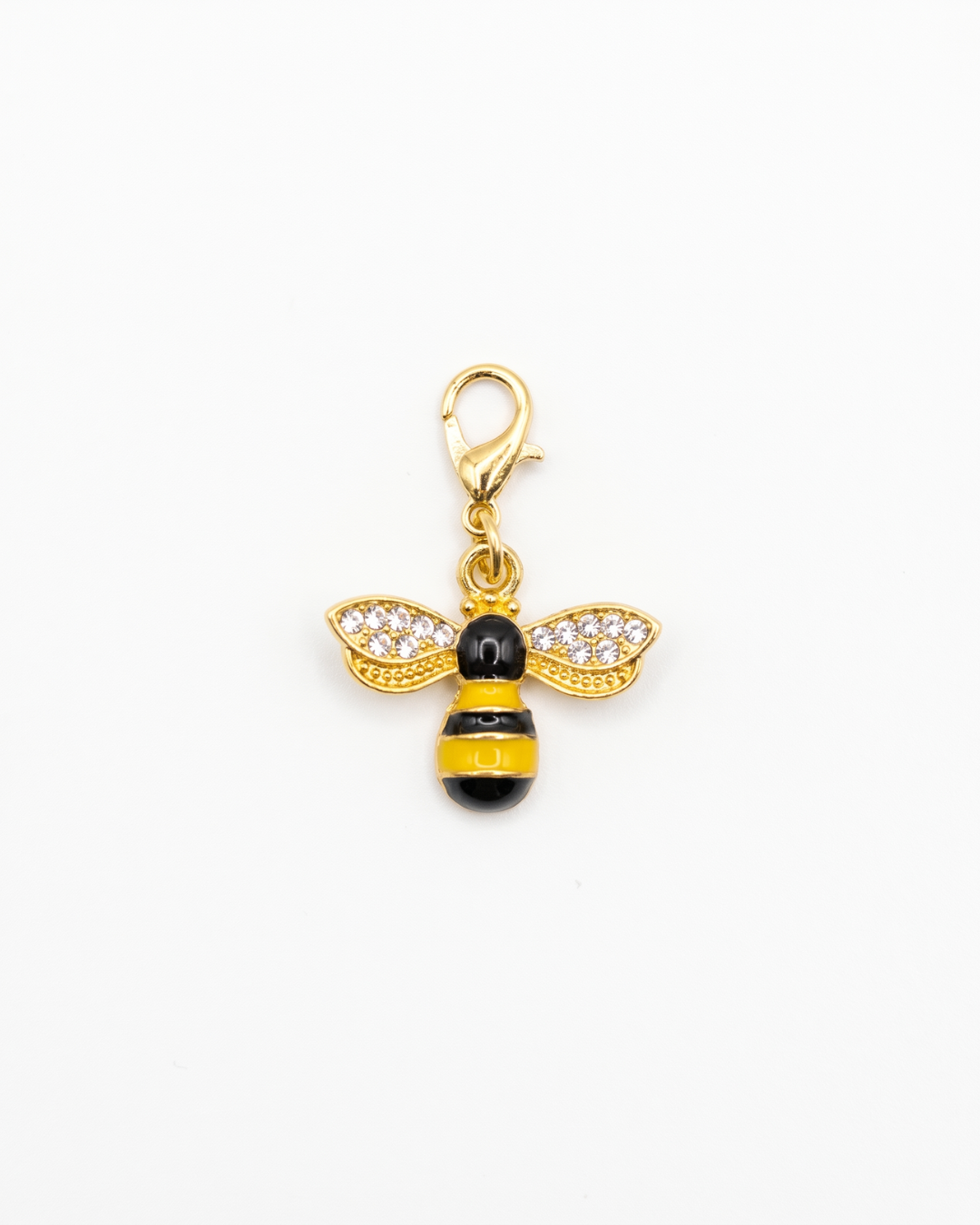 Golden and zirconia charm with lobster hook showing a yellow and black honey bee with zirconia on the wings