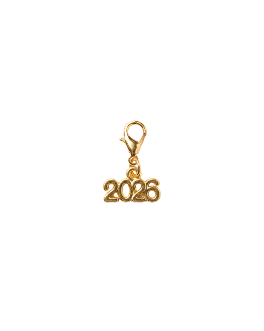 Golden charm with lobster hook showing 2026