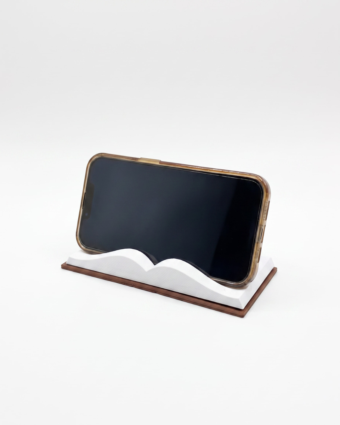 3D device stand that looks like a book holding a phone landscape