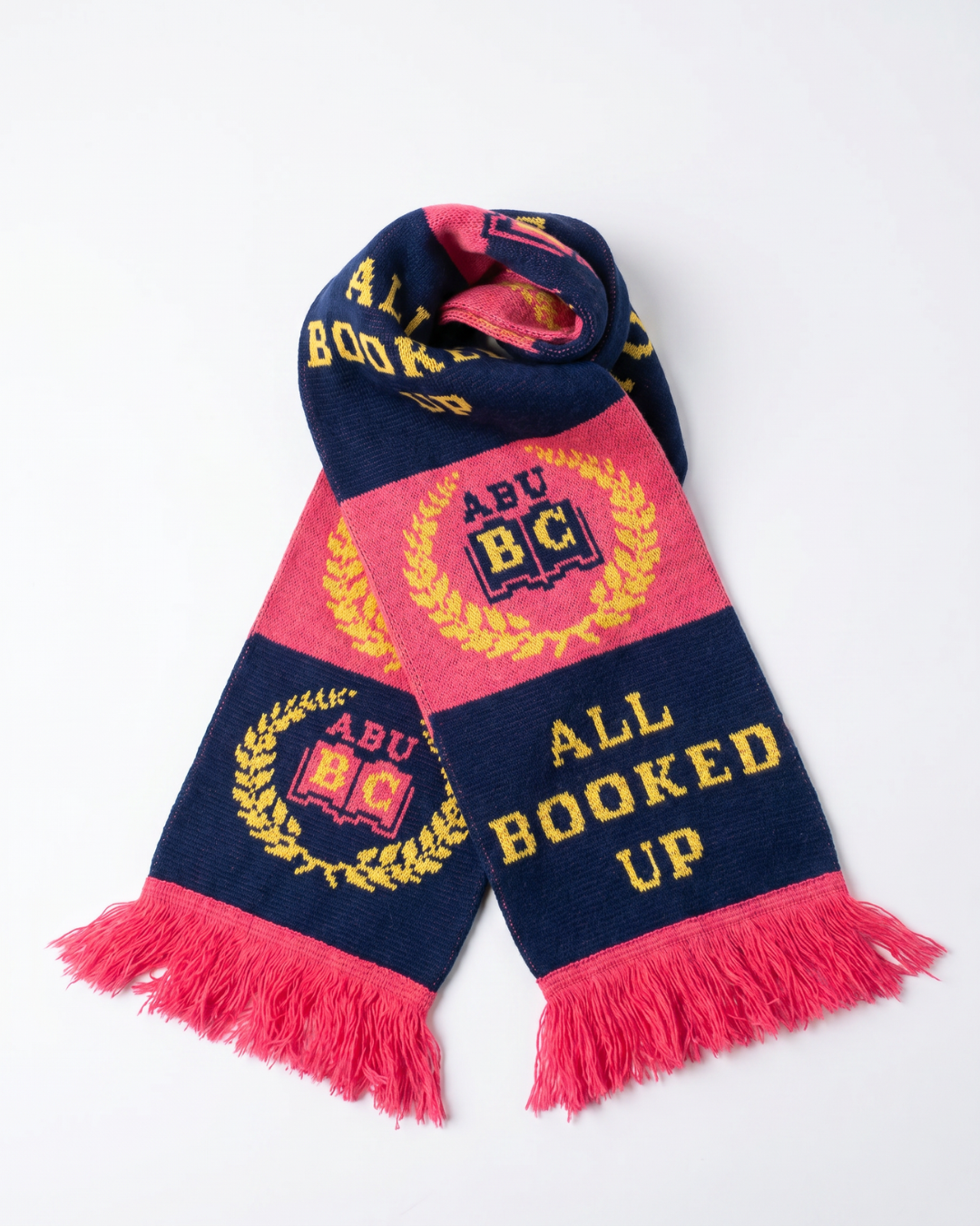 a winter scarf showing collegiate emblem for all booked up book club