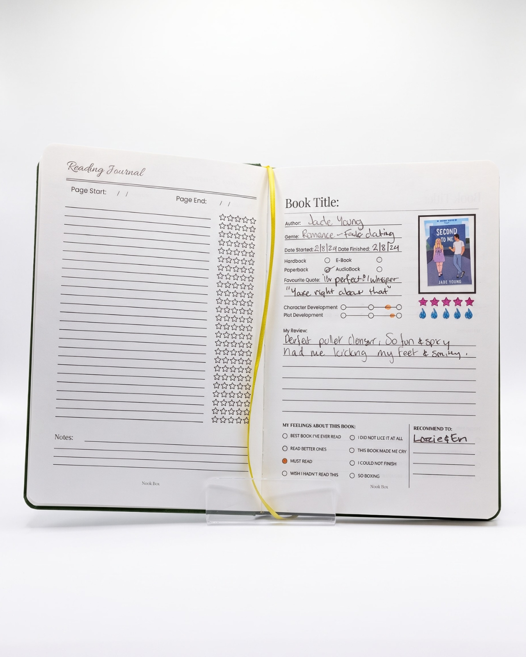 Open Nook Box reading journal showing completed book review pages, star ratings and reading notes.