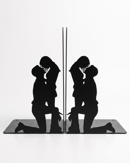 Metal Book ends featuring a man on his knees and a woman looking down