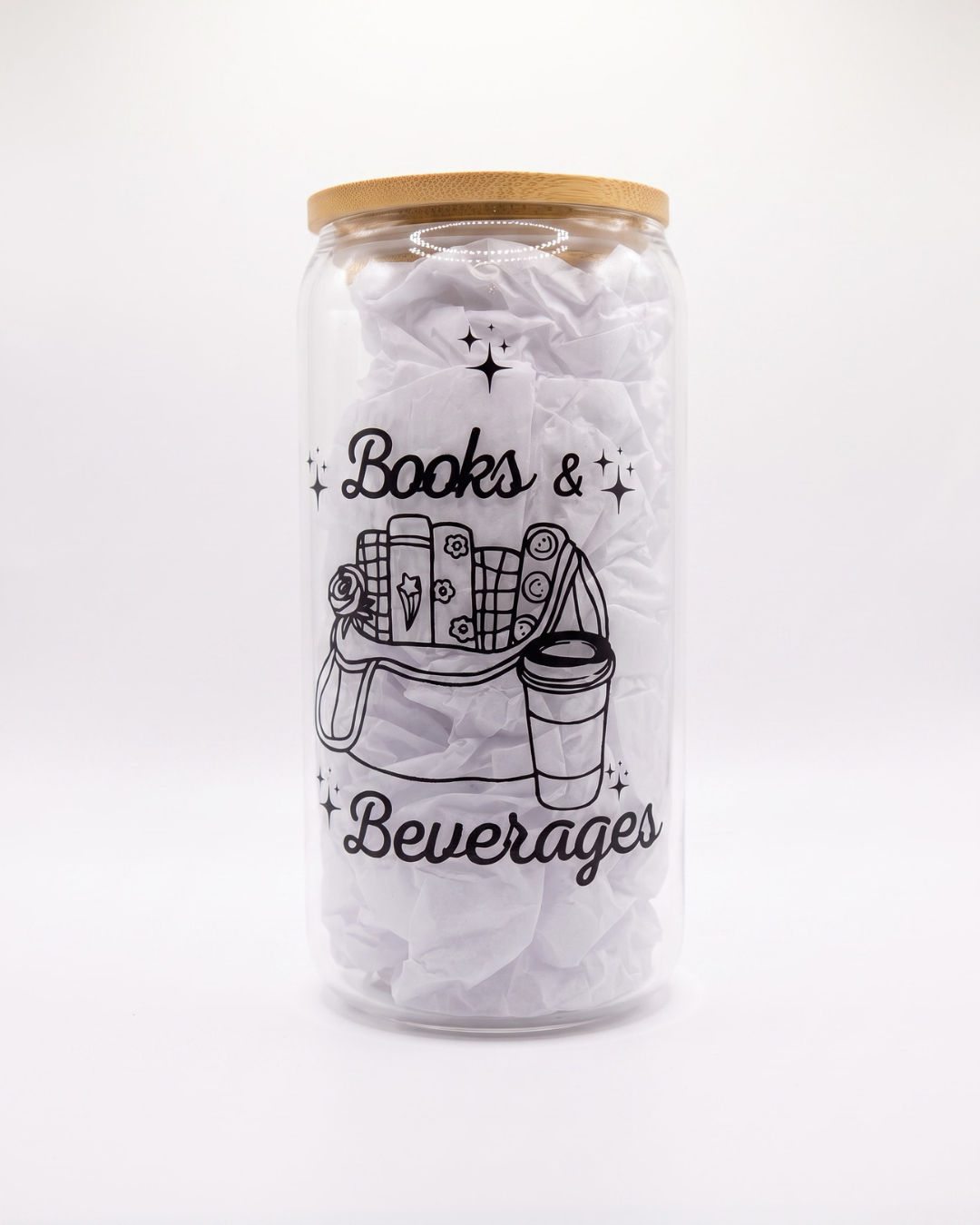 Glass can with bamboo lid featuring a "Books & Beverages" bookish illustration and reusable iced coffee design.