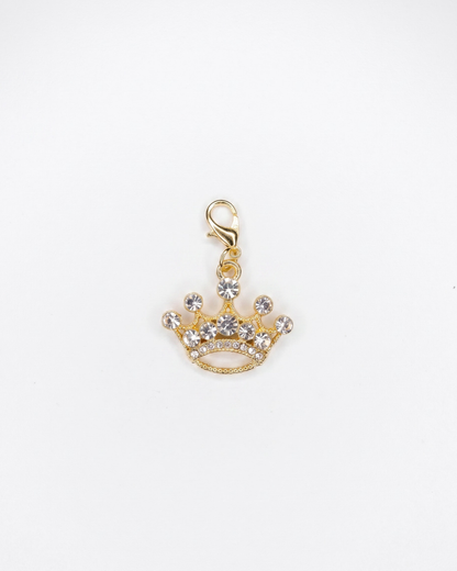 Golden charm with lobster hook showing a princess crown