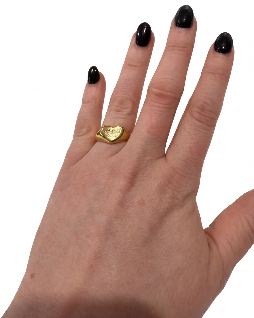 The ring on a hand on the ring finger with black nails