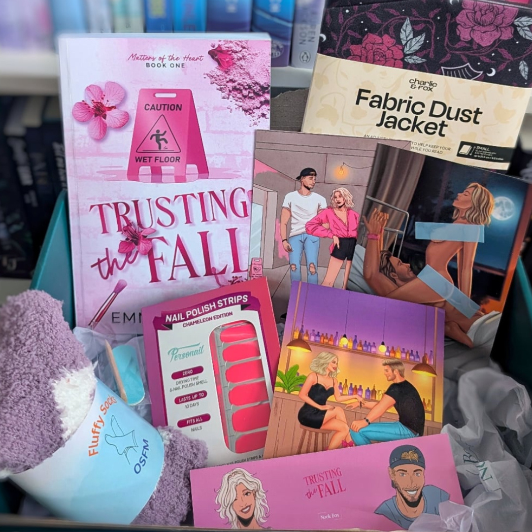 June 2025 Nook Box featuring Trusting the Fall with nail polish strips, fluffy socks, fabric dust jacket, character artwork and romance reader gifts.