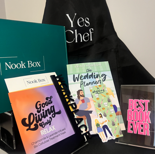 May 2025 Nook Box featuring The Wedding Planners with Yes Chef apron, reading journal, Best Book Ever shelf decor and bookish gifts
