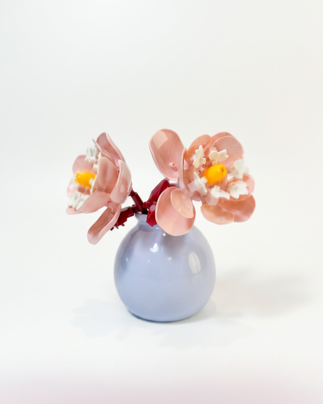 Mini building block flower arrangement in a pastel vase the flower is reminisent of peonies