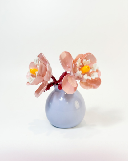 Mini building block flower arrangement in a pastel vase the flower is reminisent of peonies
