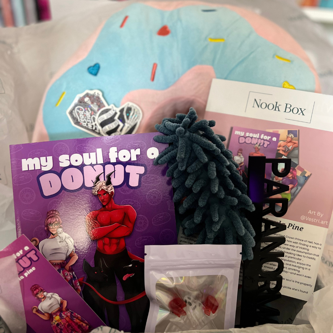 October 2025 Nook Box featuring My Soul for a Donut by Layla Pine with oversized donut plush, shelf duster, paranormal shelf decor and bookish gifts