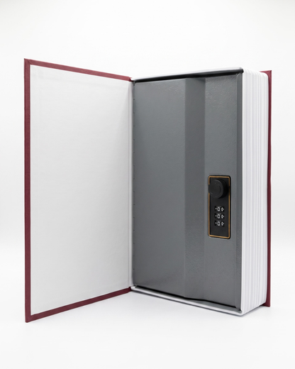 Open hidden book safe showing the internal three-digit combination lock 