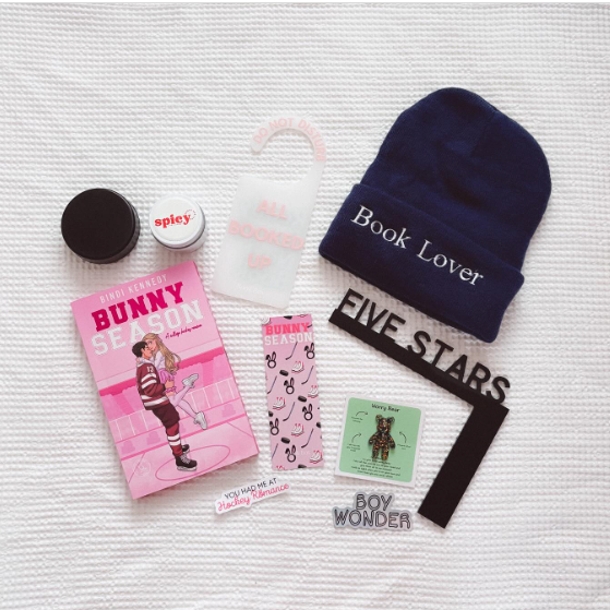 September 2025 Nook Box featuring Bunny Season by Bindi Kennedy with Book Lover beanie, Five Stars shelf decor, door hanger and bookish gifts.