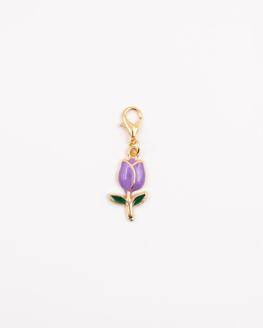 Golden and enamel charm with lobster hook showing a purple tulip